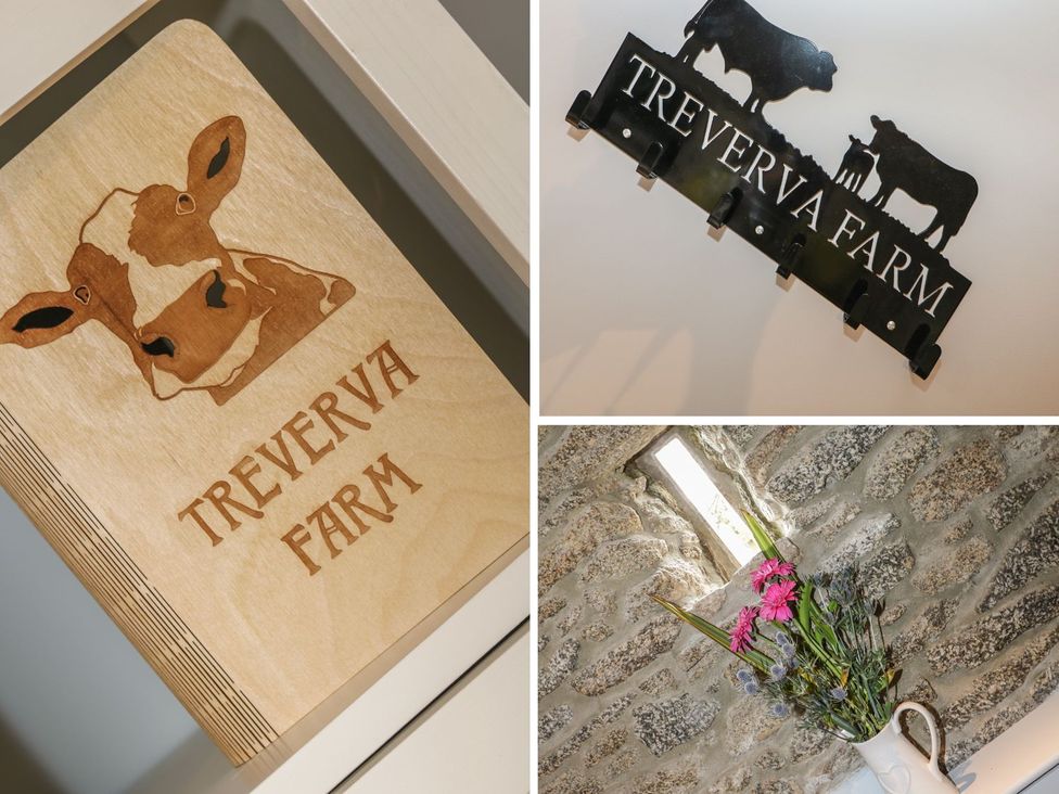 A wooden cow sign and a flower vase in a room at Treverva Farm near Constantine