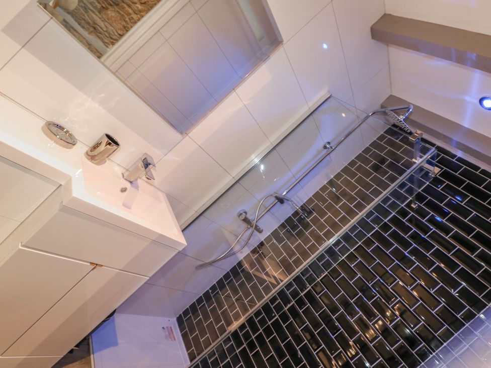 A bathroom with a sink and bath at Helford in Treverva near Constantine