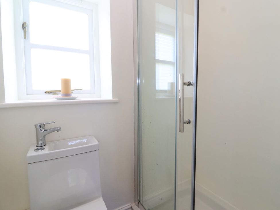 A bathroom with a shower and toilet at The Old Dairy Corsley near Warminster