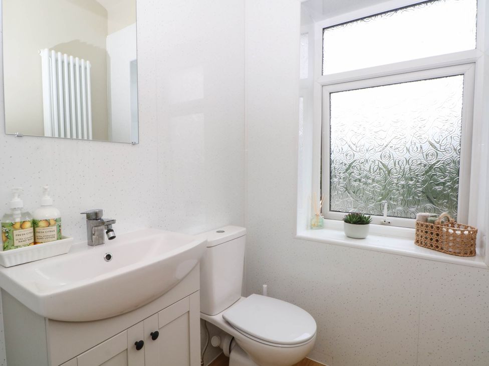 A bathroom with a sink and toilet at 2 Bentley Bridge Cottages Matlock