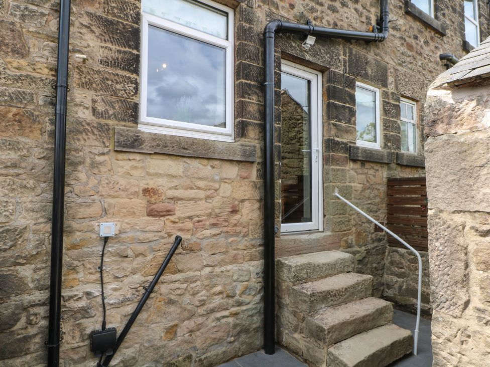 An entrance with steps and stone walls at 2 Bentley Bridge Cottages Matlock