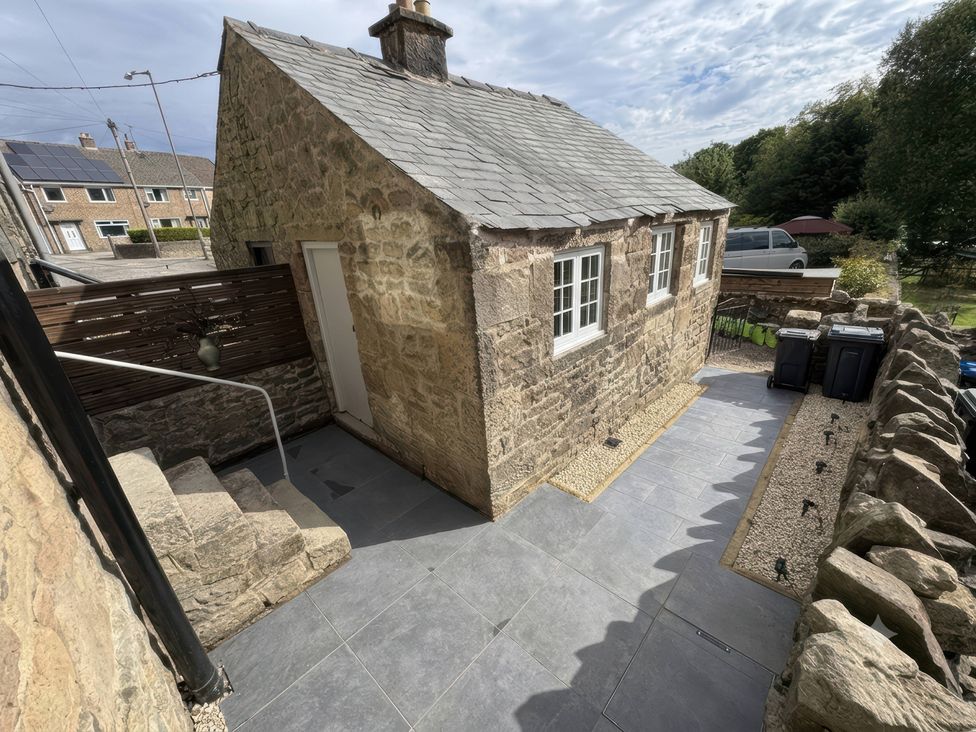 An outdoor area with a stone building and steps at 2 Bentley Bridge Cottages Matlock