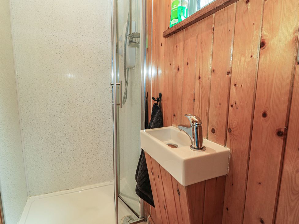 A bathroom with a shower and sink at Pippins in Taunton