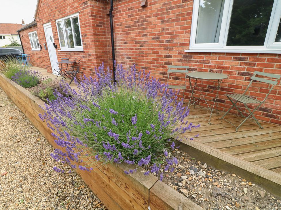 A patio area with lavender plants and metal furniture at Kirkstead in Billinghay, Lincolnshire