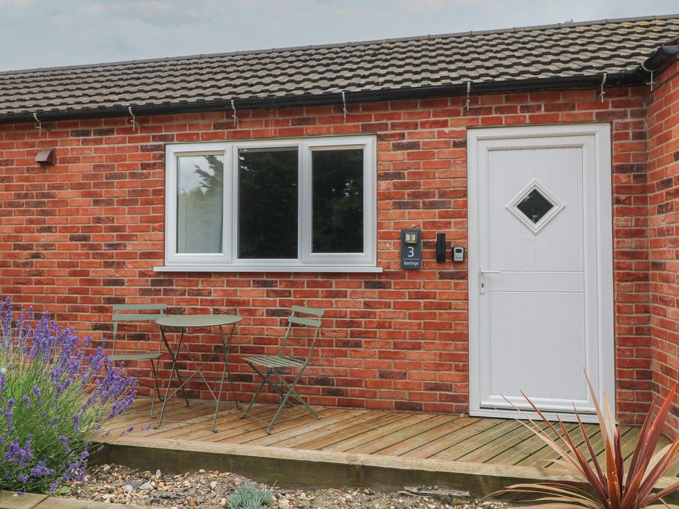 An outdoor area with a table and chairs at Barlings, Billinghay, Lincolnshire
