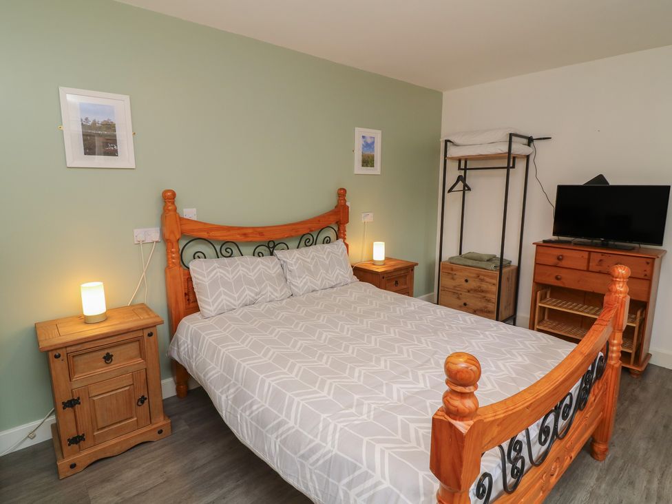 A bedroom with a bed and furniture at Barlings in Billinghay, Lincolnshire
