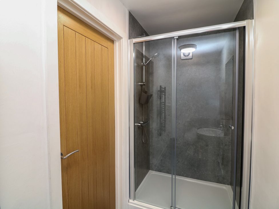 A bathroom with a shower and sink at Barlings, Billinghay, Lincolnshire