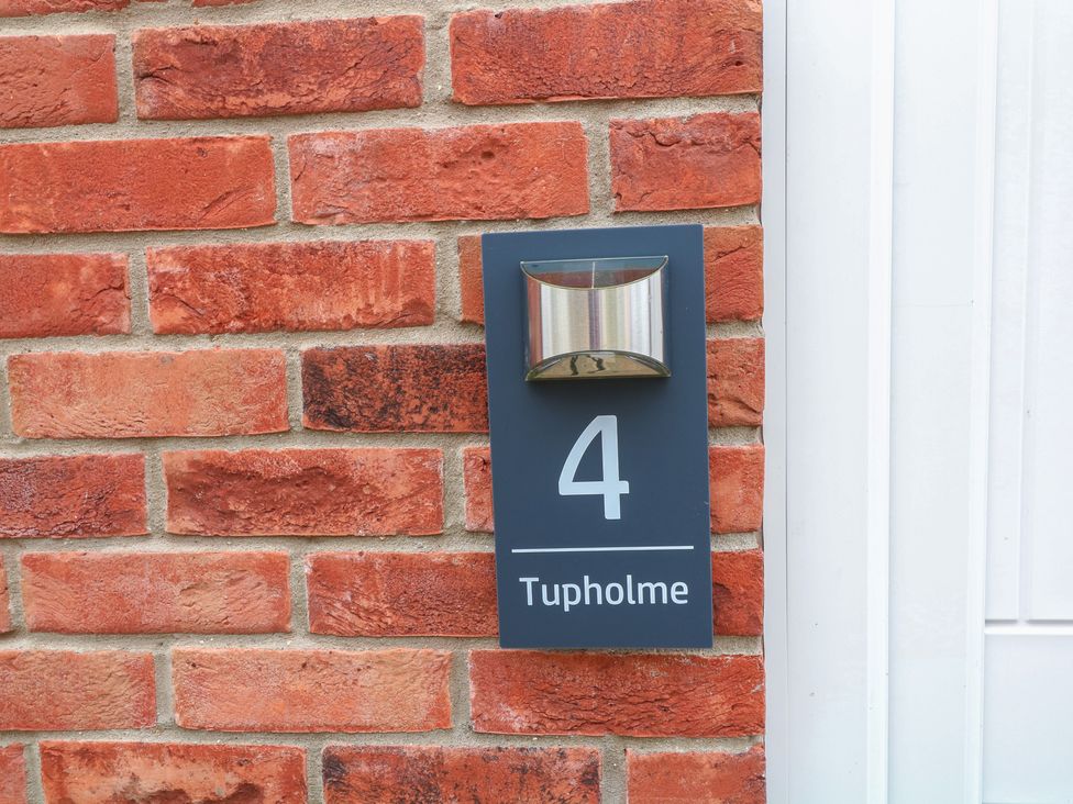A house number sign next to a door at Tupholme in Billinghay, Lincolnshire