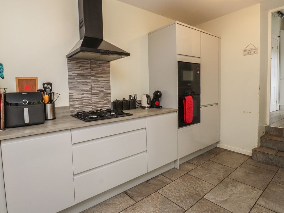 A kitchen with a stove and oven at Conway Mart Cottage in Conwy