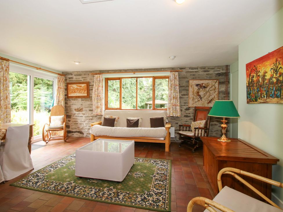 A living room with a sofa and coffee table at Kwerky Cottage 