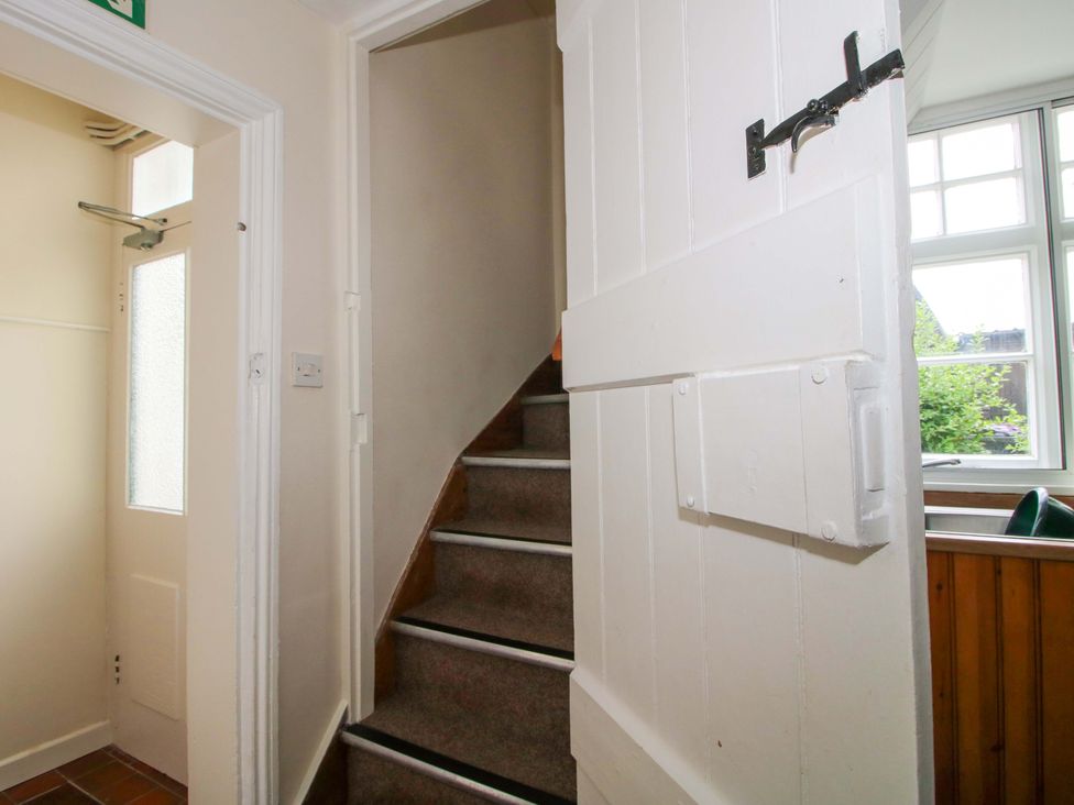 A staircase and door at Kwerky Cottage