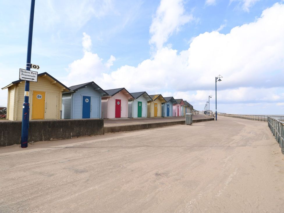 A row of beach huts at Queens Park Promenade in Mablethorpe