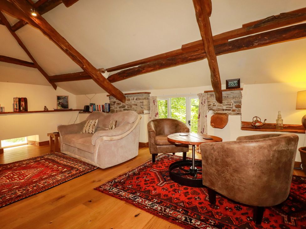 A living room with a sofa and chairs at The Water Mill at Boyton Mill Launceston