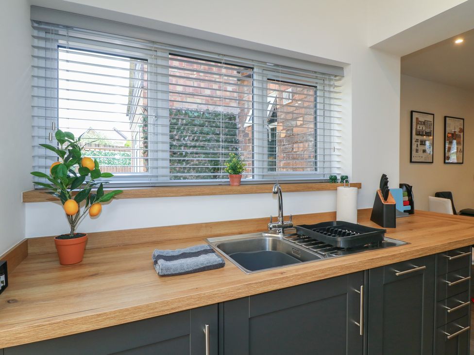A kitchen with a sink and countertop at The Kingfisher Falls in Melton Mowbray