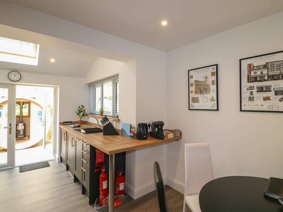 A kitchen with a counter and appliances at The Kingfisher Falls in Melton Mowbray