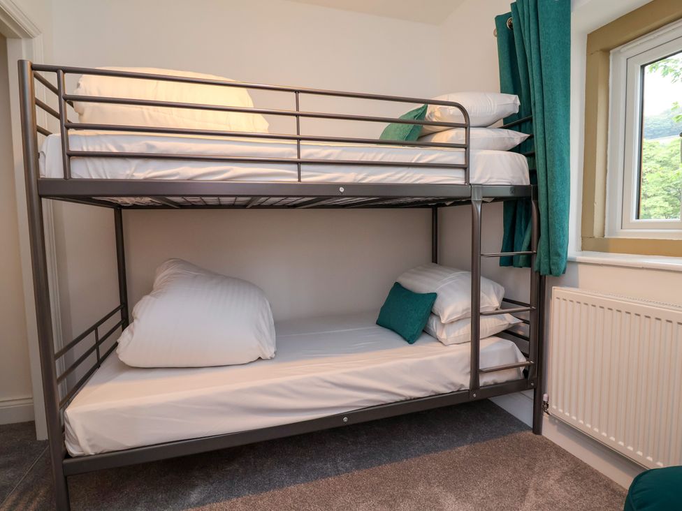 A bunk bed with pillows in a bedroom at Greenfield Manor near Greenfield