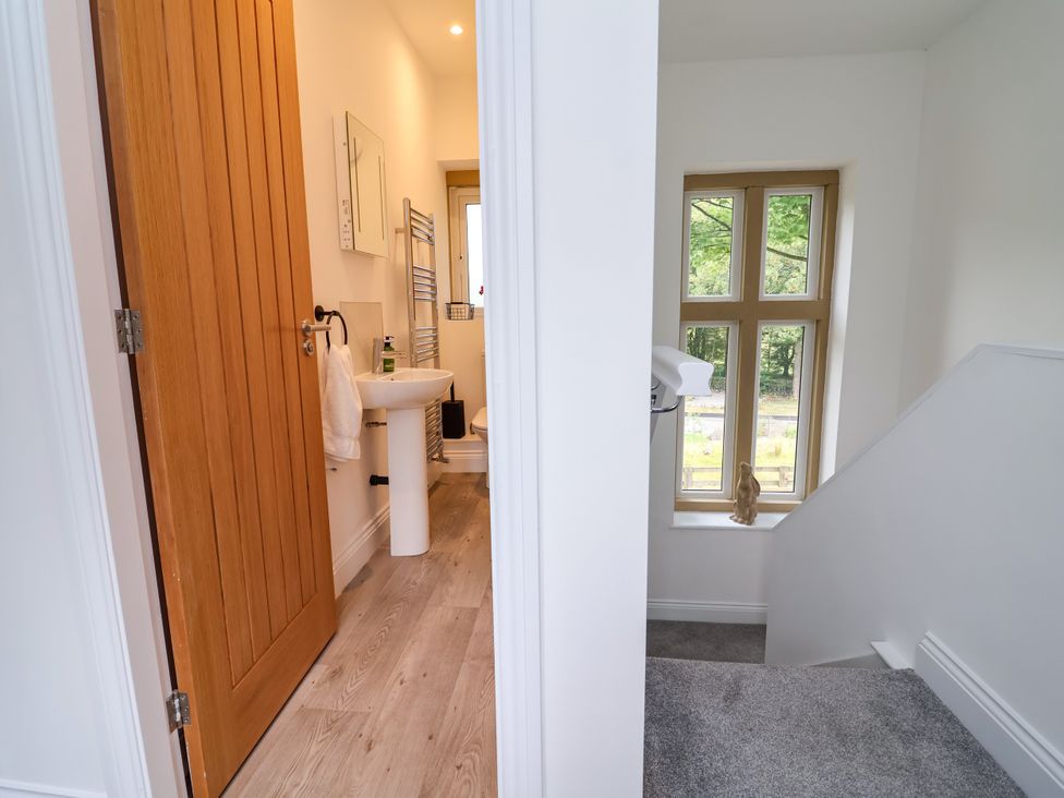 A bathroom with a sink and a toilet at Greenfield Manor near Greenfield