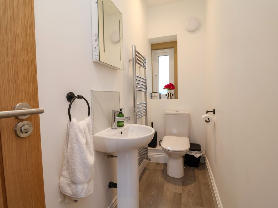 A bathroom with a sink and toilet at Greenfield Manor near Greenfield