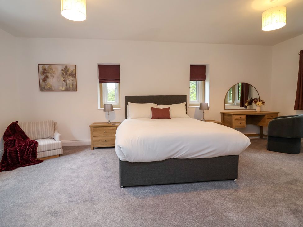 A bedroom with a bed and furniture at Greenfield Manor near Greenfield