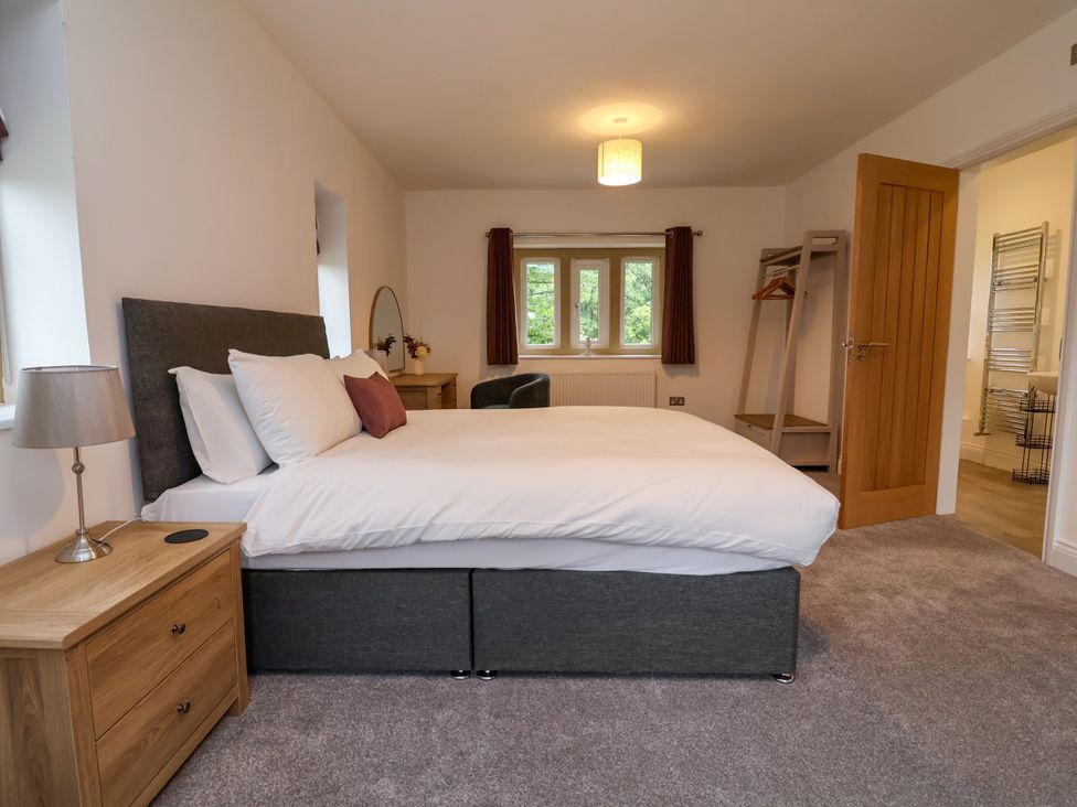 A bedroom with a bed and a window at Greenfield Manor near Greenfield