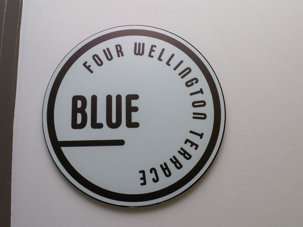 A sign indicating Four Wellington Terrace and Blue