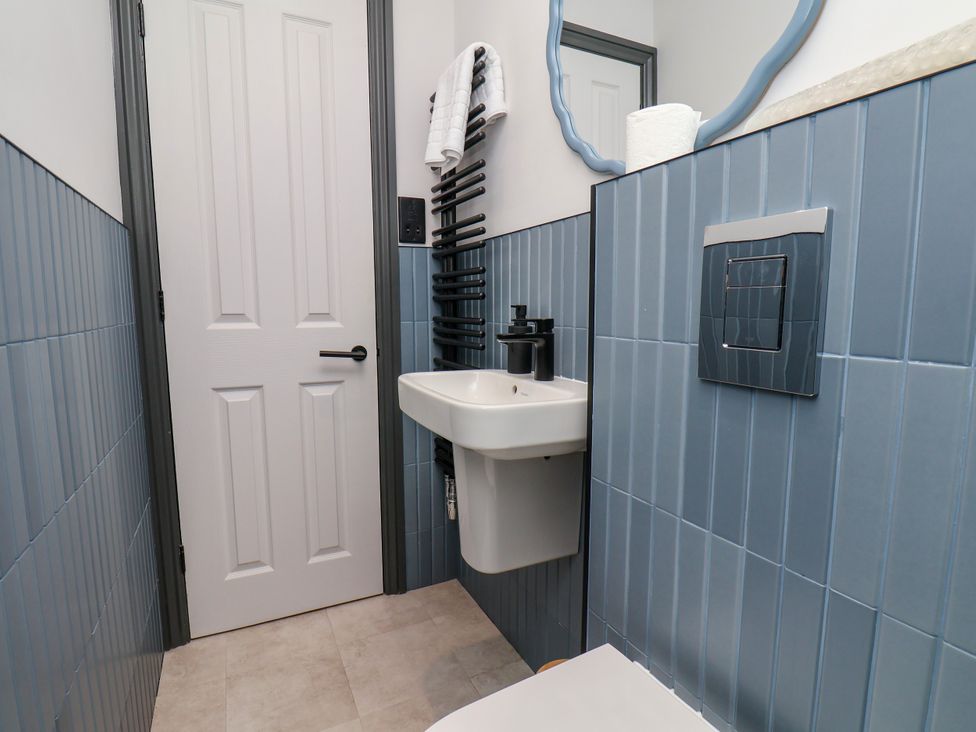 A bathroom with a sink and toilet at Apartment Blue in Whitby