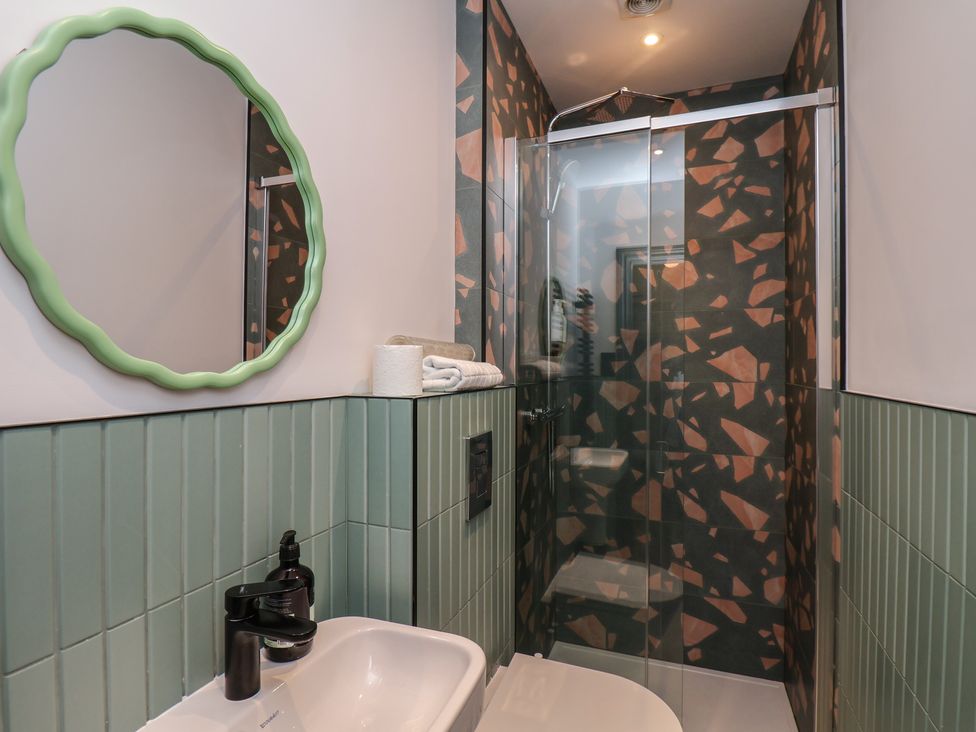 A bathroom with a shower and a sink at Apartment Green in Whitby