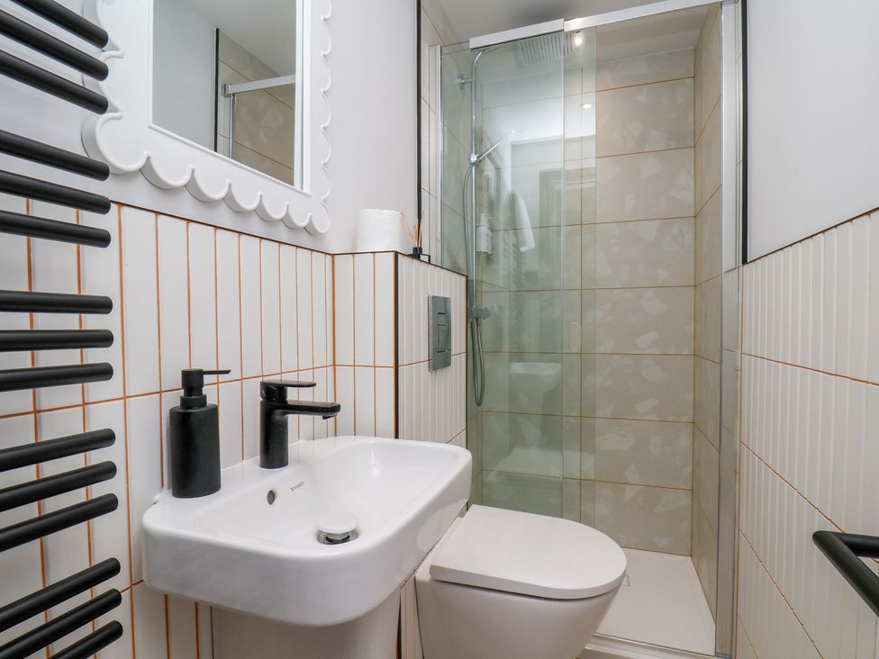 A bathroom with a shower and sink at Apartment Yellow in Whitby