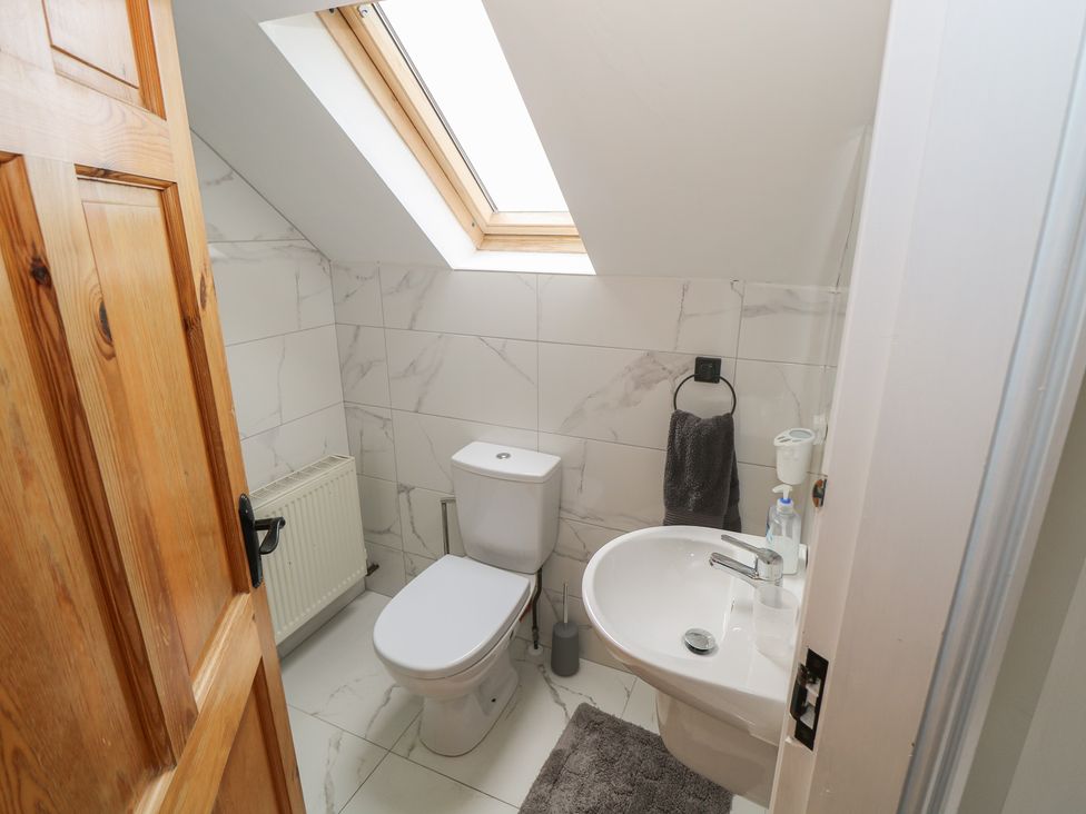 A bathroom with a toilet and sink at Islands Inn in Louisburgh, County Mayo