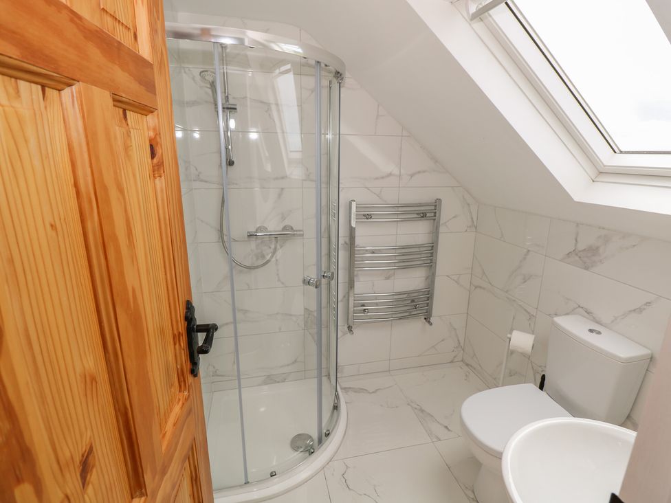 A bathroom with shower and toilet at Islands Inn in Louisburgh, County Mayo