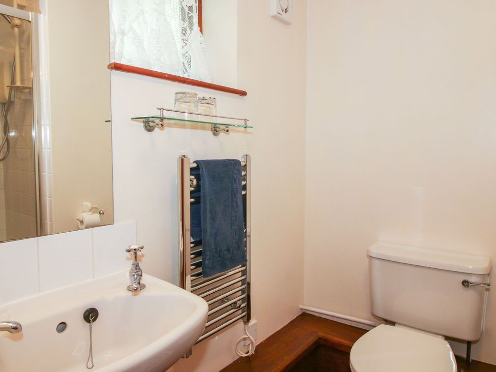 A bathroom with a sink and toilet at Apartment 1 in Lydbury North