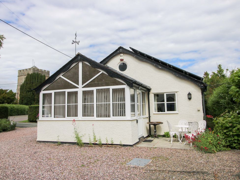 A house with a porch and garden at Willow Cottage in Lydbury North