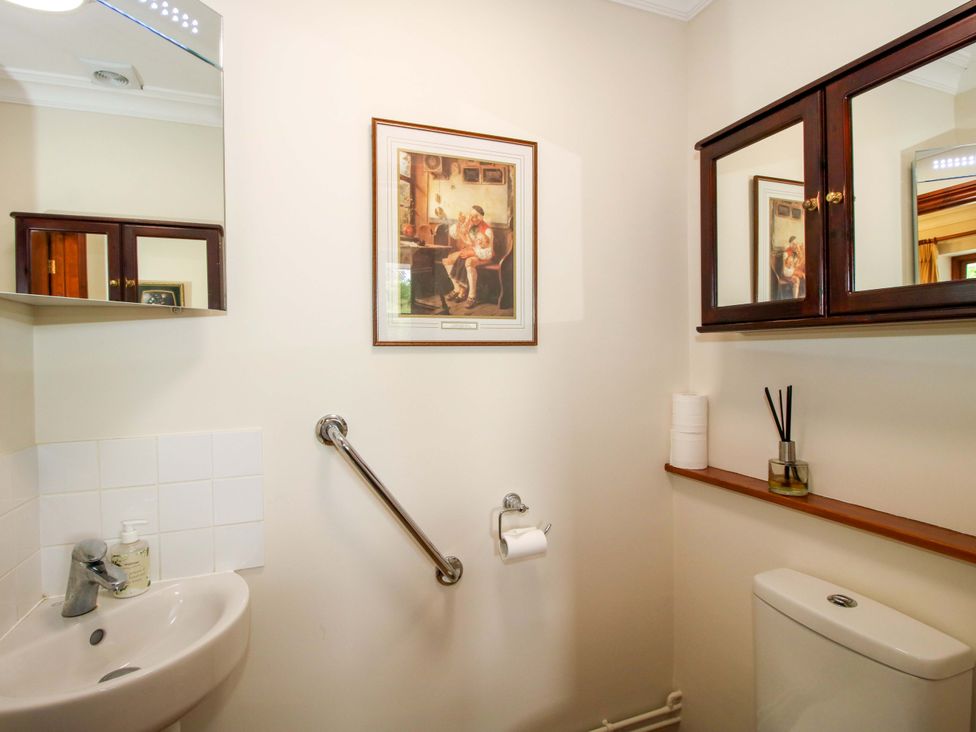 A bathroom with a sink and toilet at Willow Cottage in Lydbury North