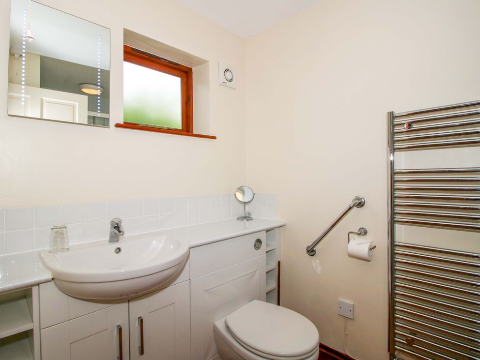 A bathroom with a sink and toilet at Willow Cottage in Lydbury North