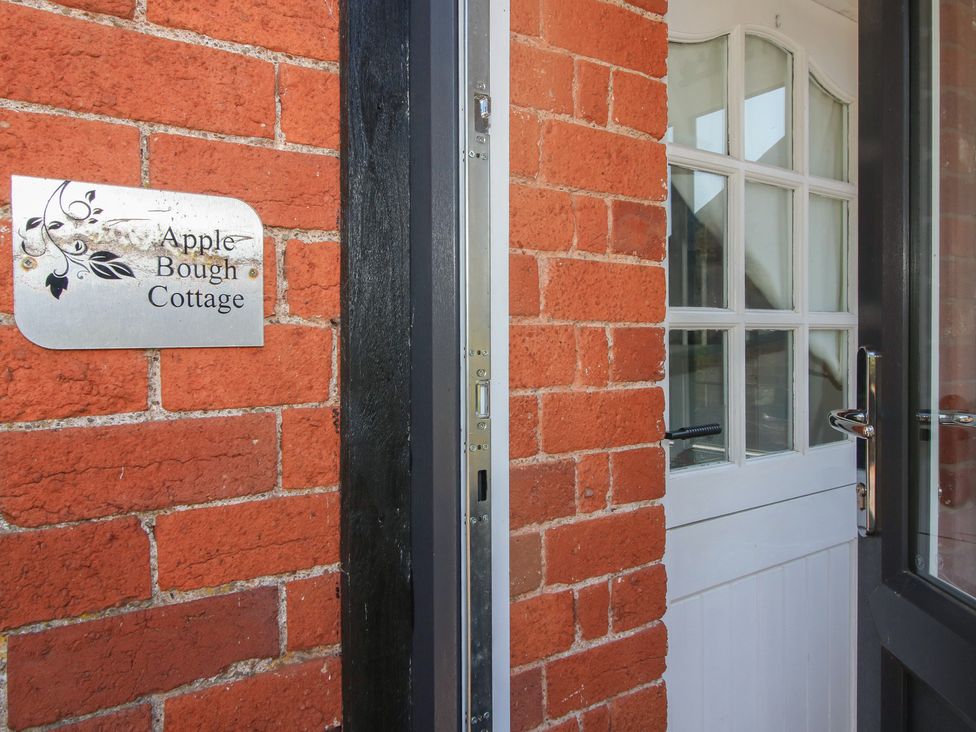 An entrance with a door and a nameplate at Apple Bough Cottage in Kinnersley near Weobley