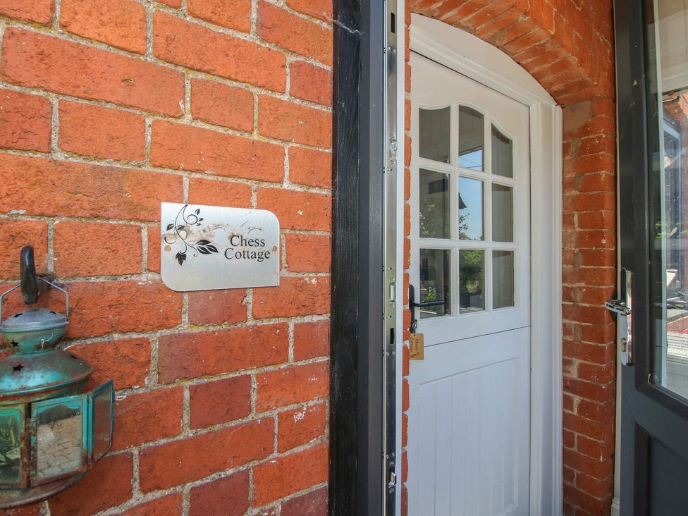 An entrance with a door and nameplate at Chess Cottage in Weobley