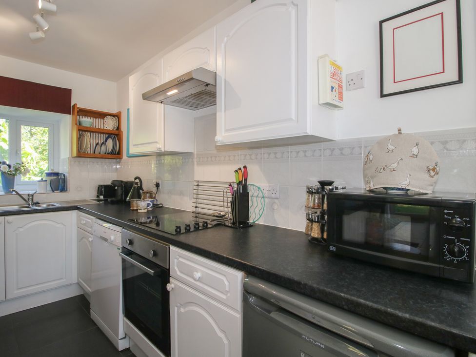 A kitchen with appliances and utensils at Chess Cottage in Weobley