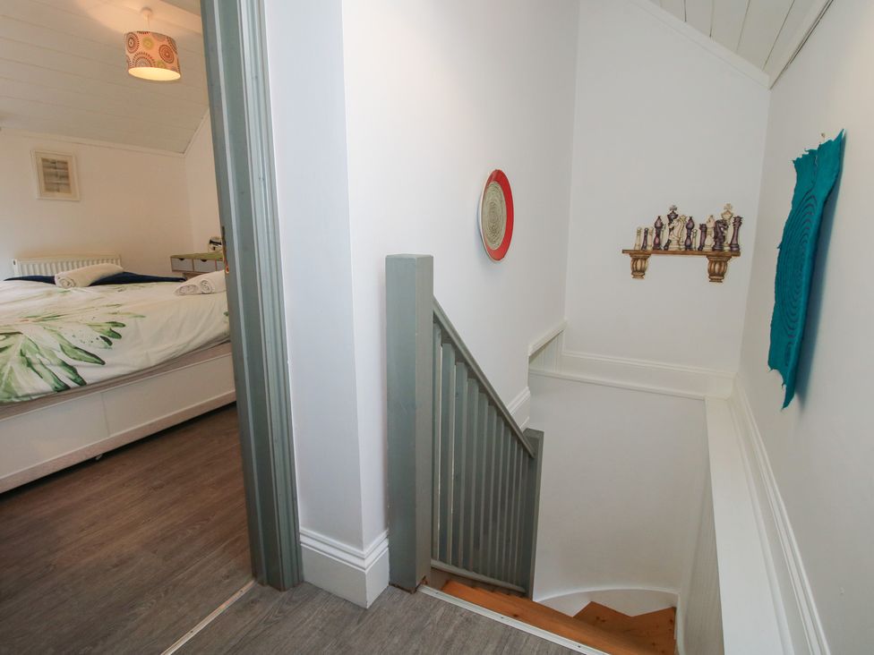 A staircase leading to a bedroom with a bed at Chess Cottage in Weobley