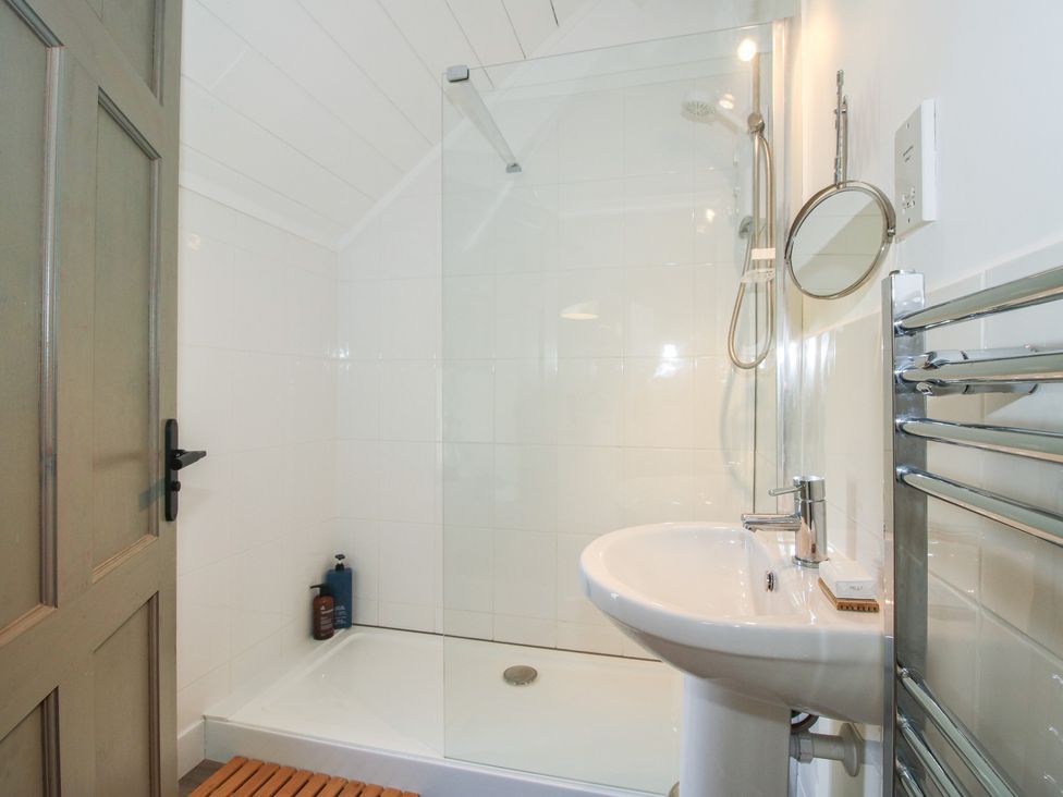 A bathroom with a shower and sink at Chess Cottage Weobley