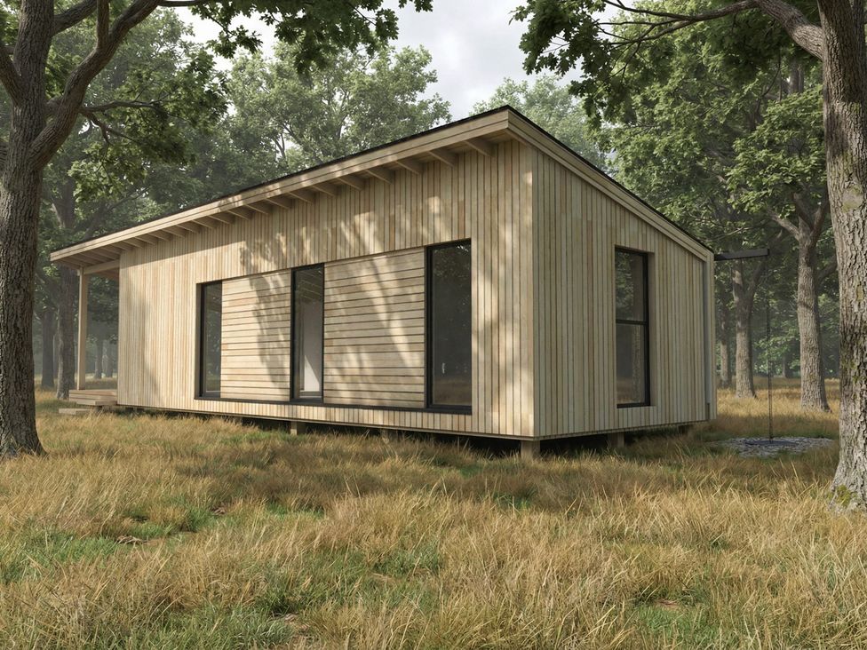 A cabin with large windows surrounded by trees at Arbora 1.0 Spa (Pet) in Malvern