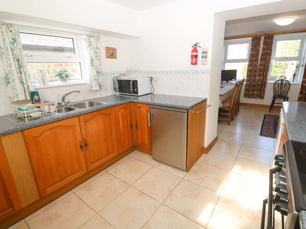 A kitchen with cabinets and appliances at Chyandaunce in Penzance