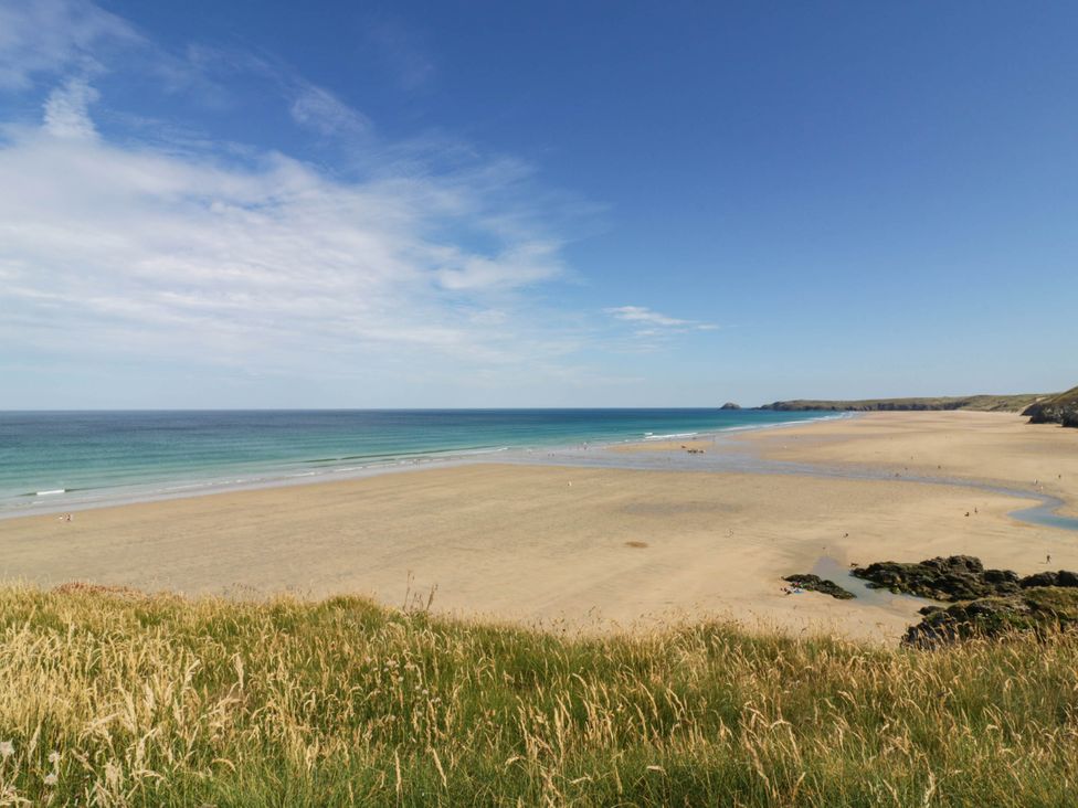 A beach with sand and water at Roslenn in St Agnes