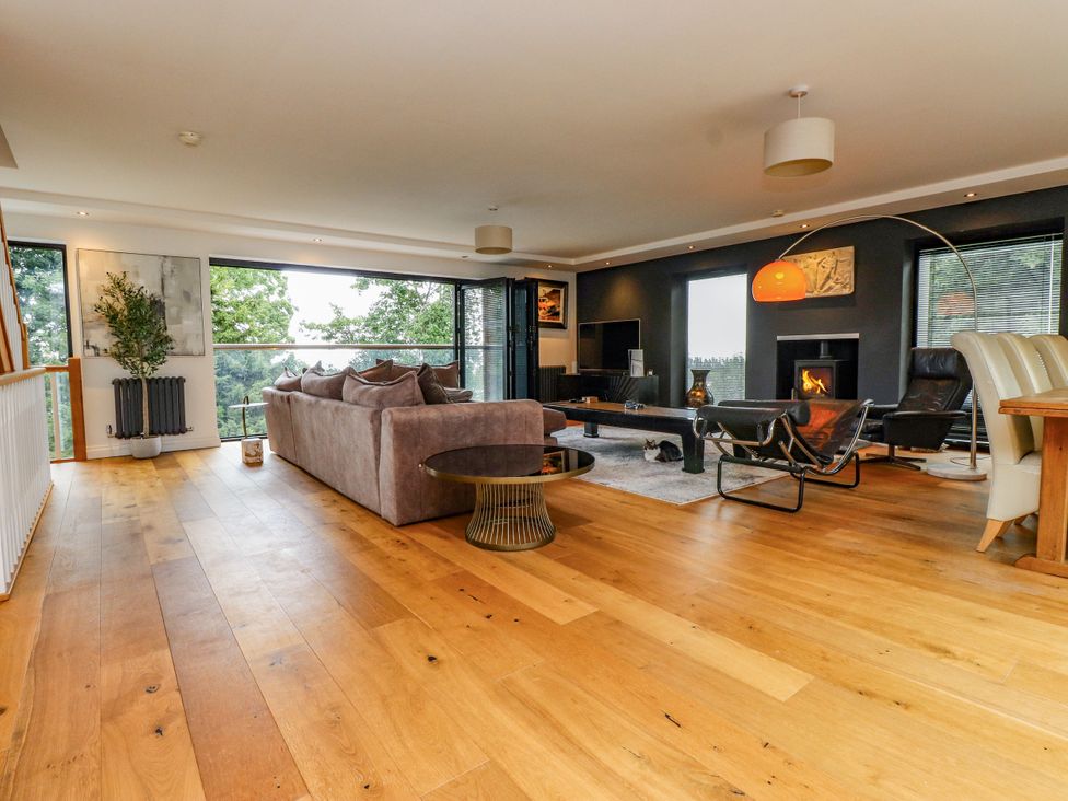 A living room with a sofa and coffee table at The Barn at Bryn Eithin Colwyn Bay