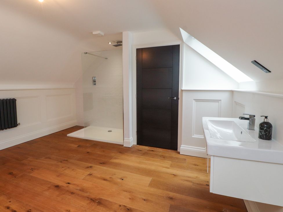 A bathroom with shower and basin at The Barn at Bryn Eithin Colwyn Bay