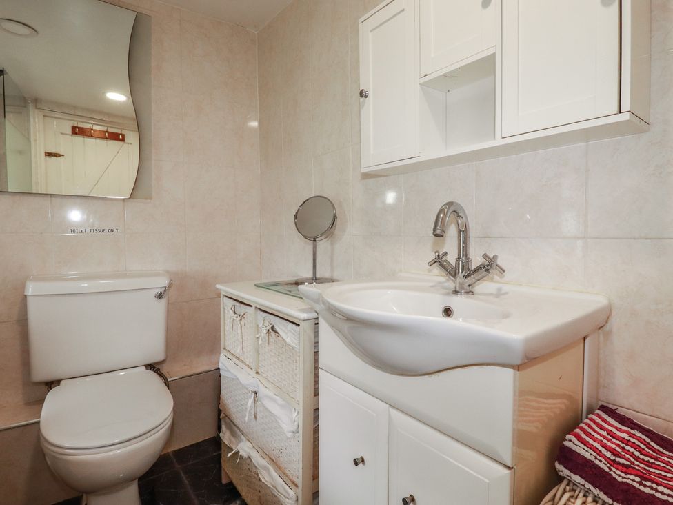 A bathroom with a sink and toilet at Rose Cottage in Launceston