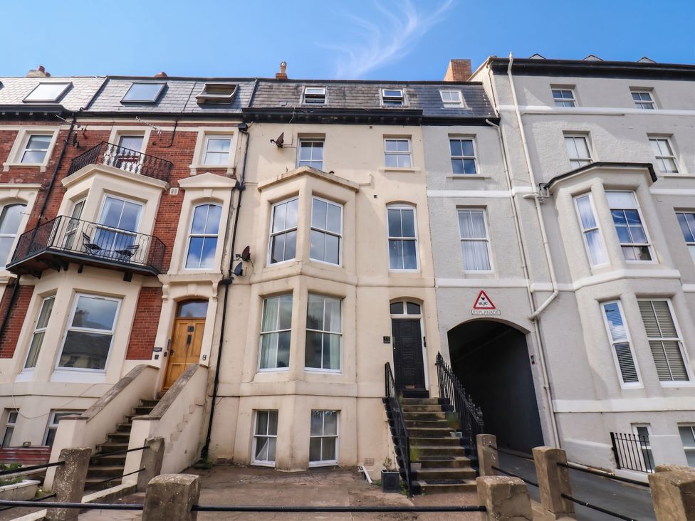 A building with balconies and stairs at Sea View Apartment in Whitby