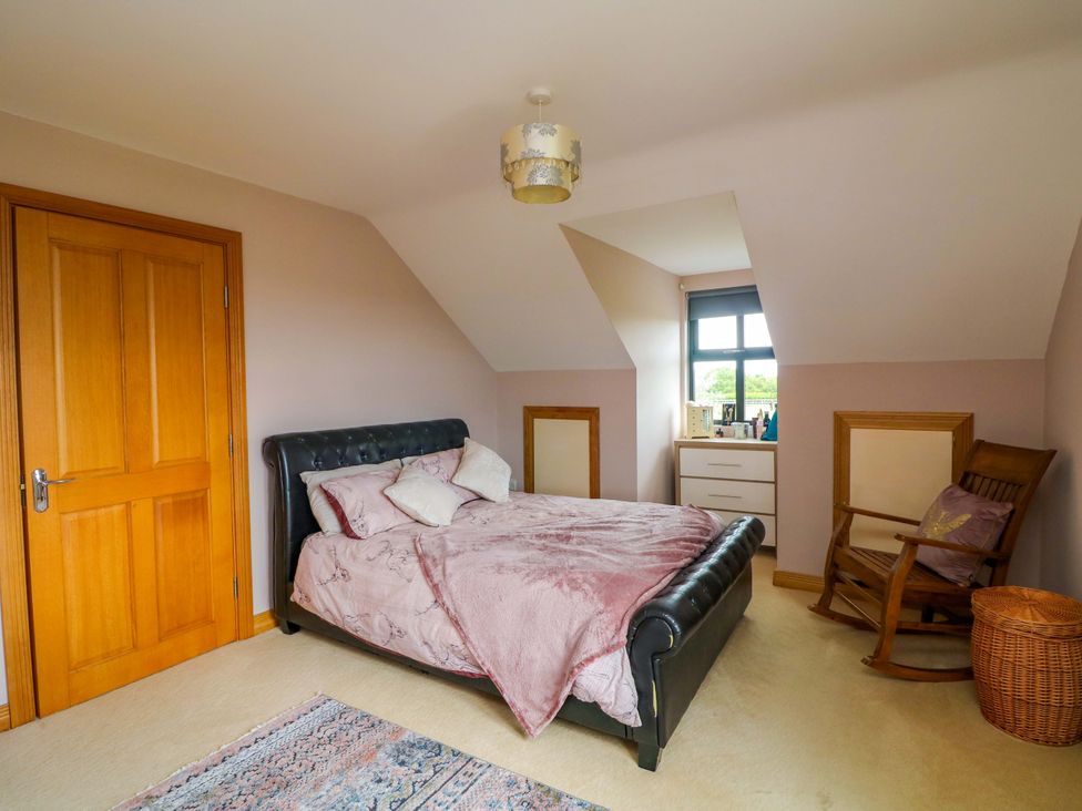 A bedroom with a bed and dresser at Vernegly in Banonow