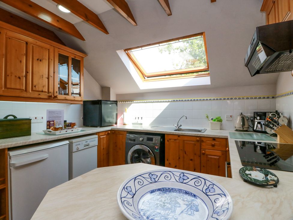 A kitchen with a sink and various appliances at Buchanan’s Bothy in Glencarse