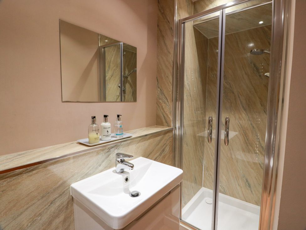 A bathroom with a shower and sink at Buchanan’s Bothy in Glencarse