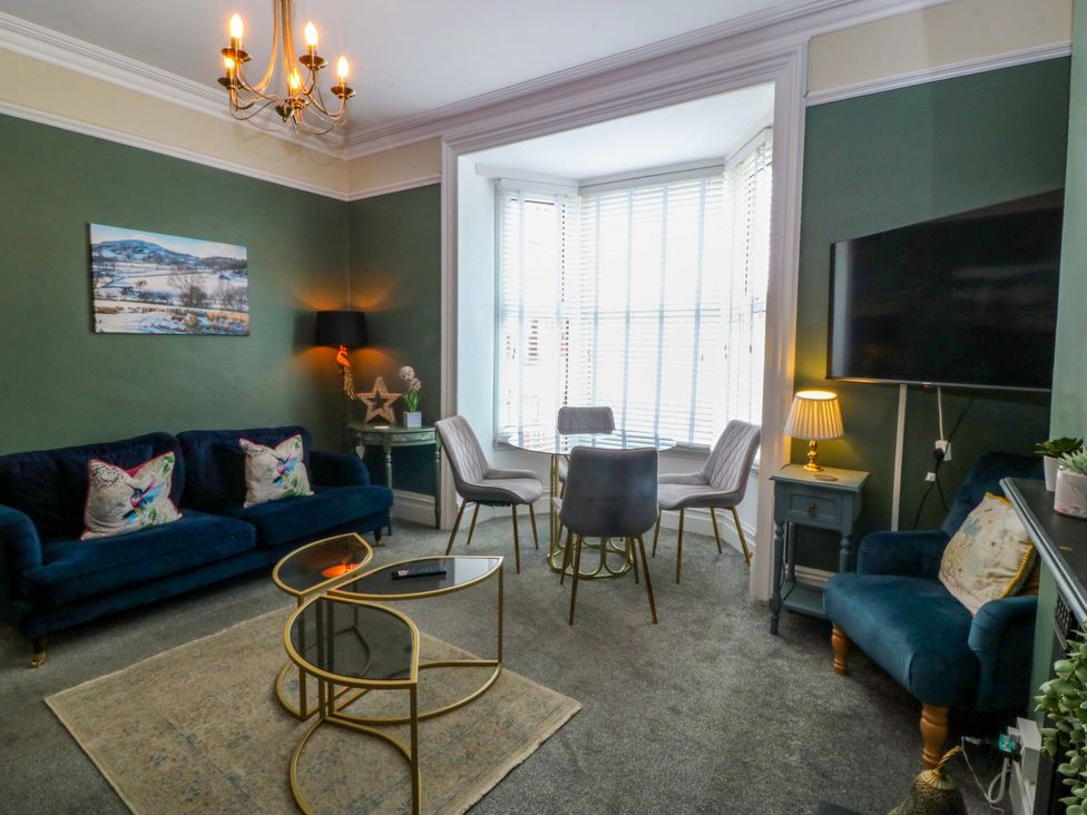 A living room with a sofa and coffee table at Jack's House in Tywyn